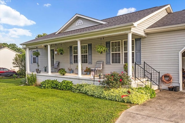 4190 Tanyard Hill Rd, Lynchburg, TN 37352 - view of front of property with covered porch, a front lawn, and roof with shingles