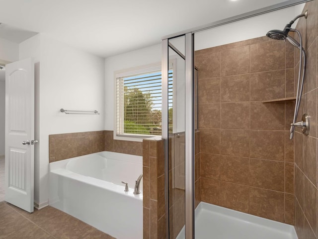 3029 Alan Dr, Spring Hill, TN 37174 - bathroom featuring tile patterned flooring, a stall shower, and a bath
