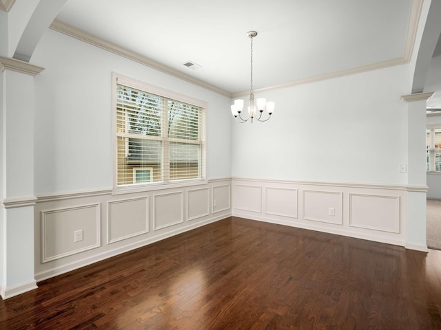 3029 Alan Dr, Spring Hill, TN 37174 - unfurnished dining area featuring crown molding, a chandelier, a wainscoted wall, dark wood-style floors, and a decorative wall