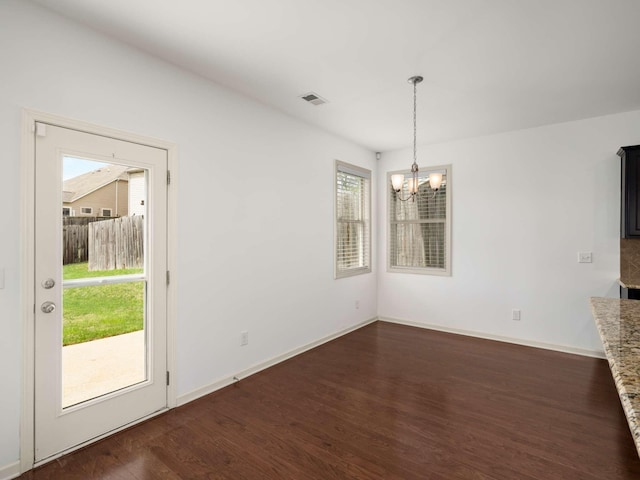 3029 Alan Dr, Spring Hill, TN 37174 - unfurnished dining area featuring a chandelier, dark wood-style floors, and baseboards