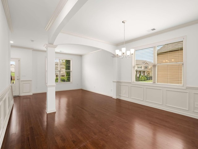 3029 Alan Dr, Spring Hill, TN 37174 - unfurnished room with ornate columns, crown molding, a decorative wall, a chandelier, and a wainscoted wall