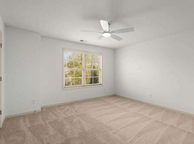 3029 Alan Dr, Spring Hill, TN 37174 - empty room featuring light colored carpet, a ceiling fan, and baseboards