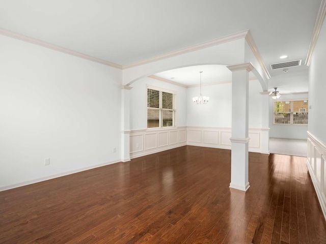 3029 Alan Dr, Spring Hill, TN 37174 - unfurnished living room with ornate columns, crown molding, dark wood-style floors, a chandelier, and a wainscoted wall