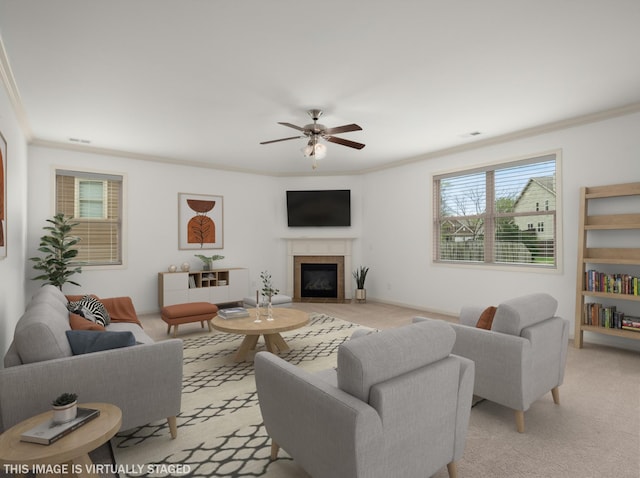 3029 Alan Dr, Spring Hill, TN 37174 - living area with ornamental molding, a fireplace with flush hearth, ceiling fan, and light colored carpet