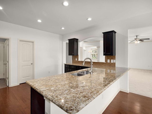 3029 Alan Dr, Spring Hill, TN 37174 - kitchen featuring a sink, arched walkways, ceiling fan, dark wood-type flooring, and recessed lighting