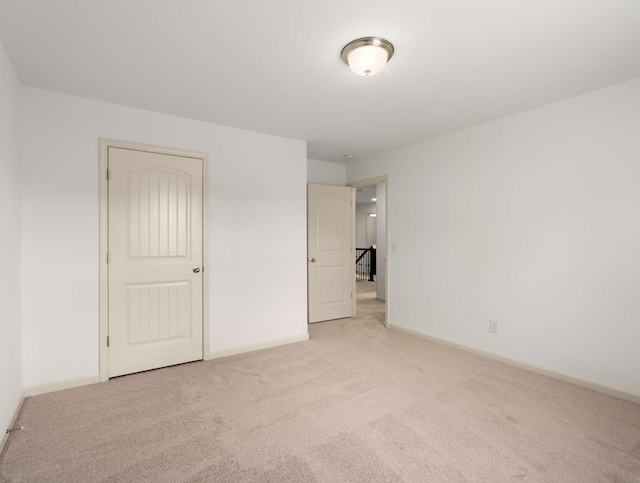 3029 Alan Dr, Spring Hill, TN 37174 - unfurnished bedroom featuring light carpet and baseboards