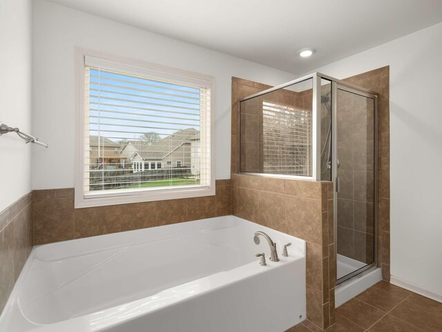 3029 Alan Dr, Spring Hill, TN 37174 - bathroom with a shower stall, tile patterned floors, and a bath