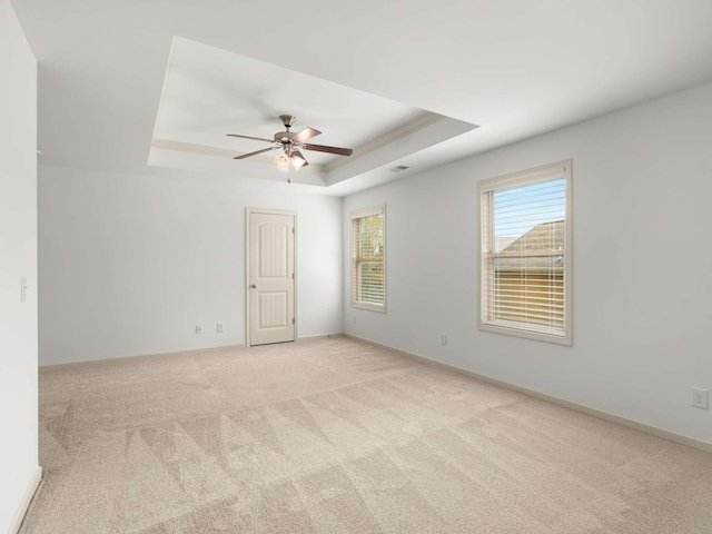 3029 Alan Dr, Spring Hill, TN 37174 - unfurnished room with a tray ceiling, light carpet, and a ceiling fan