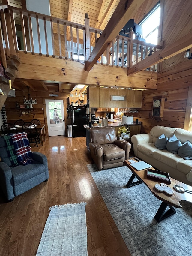 225 Bill Hunter Rd, Celina, TN 38551 - living area with wood walls, wood-type flooring, high vaulted ceiling, and beamed ceiling