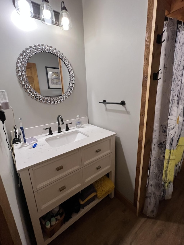 225 Bill Hunter Rd, Celina, TN 38551 - full bathroom featuring wood finished floors, vanity, and a shower with shower curtain