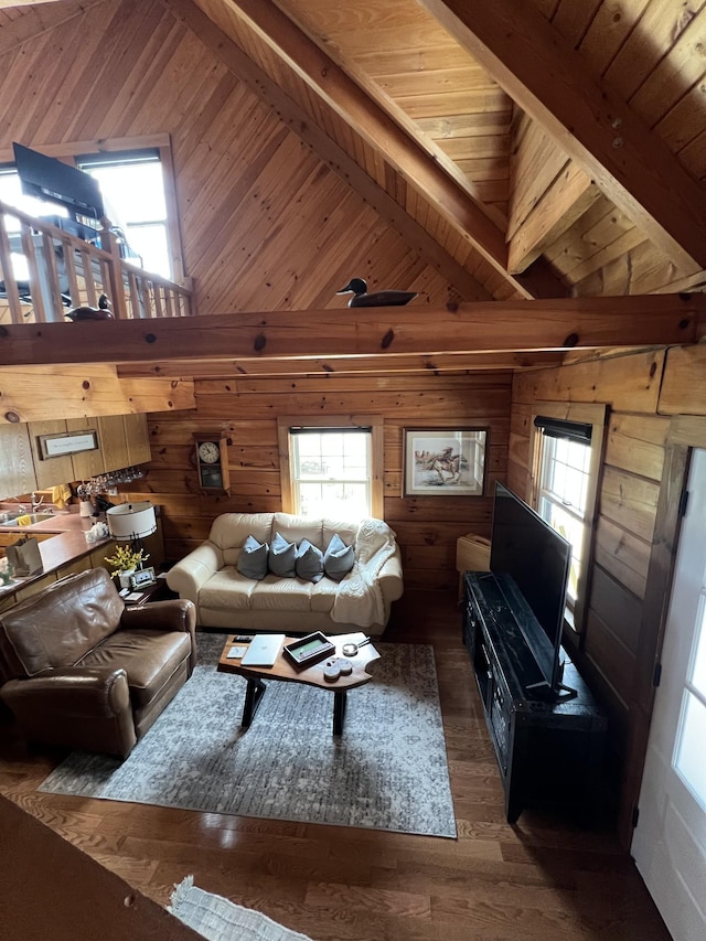 225 Bill Hunter Rd, Celina, TN 38551 - living area with wood walls, healthy amount of natural light, wood finished floors, wooden ceiling with exposed beams, and high vaulted ceiling