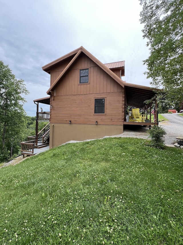 225 Bill Hunter Rd, Celina, TN 38551 - view of property exterior featuring a yard, stairway, and board and batten siding