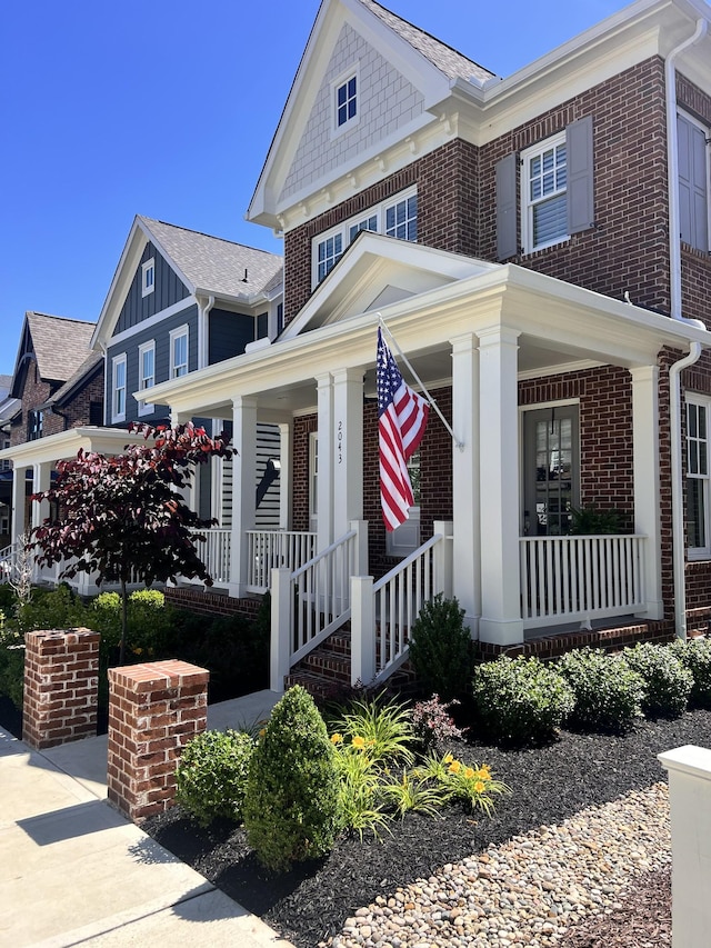 2043 Nathaniel Rd, Franklin, TN 37064 - view of front of property featuring brick siding and a porch