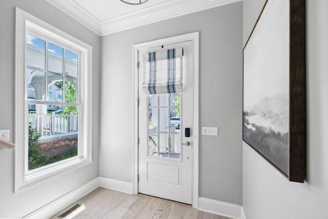 2043 Nathaniel Rd, Franklin, TN 37064 - doorway featuring baseboards, crown molding, and light wood-style flooring