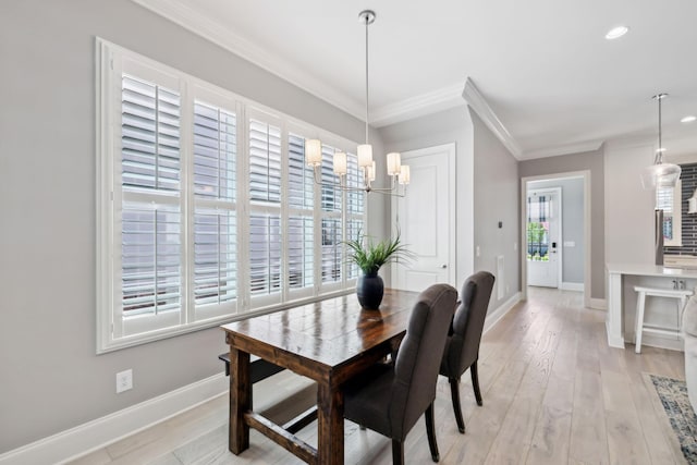 2043 Nathaniel Rd, Franklin, TN 37064 - dining room featuring crown molding, baseboards, a chandelier, light wood-style floors, and recessed lighting