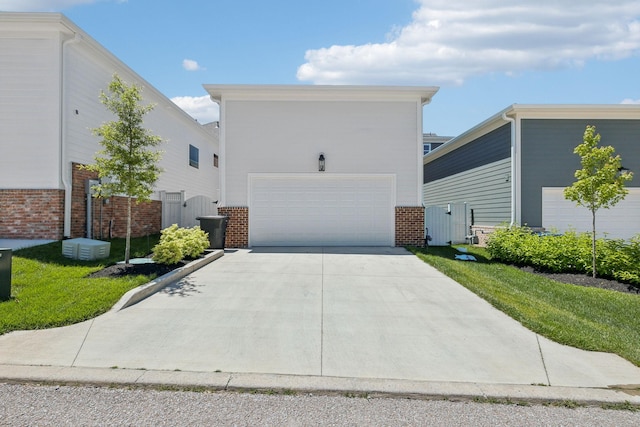 2043 Nathaniel Rd, Franklin, TN 37064 - view of front of home featuring brick siding, a gate, and concrete driveway