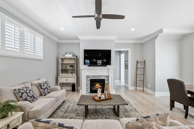 2043 Nathaniel Rd, Franklin, TN 37064 - living area with ceiling fan, recessed lighting, ornamental molding, light wood-type flooring, and a fireplace with flush hearth