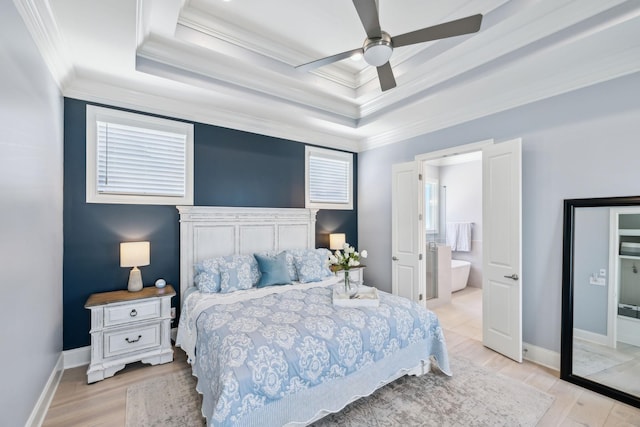 2043 Nathaniel Rd, Franklin, TN 37064 - bedroom featuring a raised ceiling, crown molding, light wood-type flooring, a ceiling fan, and baseboards
