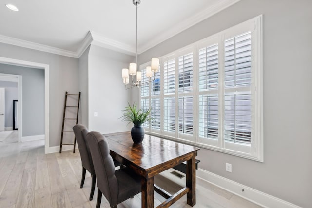 2043 Nathaniel Rd, Franklin, TN 37064 - dining area featuring crown molding, a chandelier, baseboards, and light wood-style floors