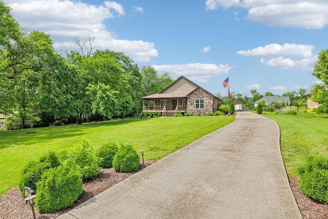 200 Lindsey Hollow Rd, Gallatin, TN 37066 - view of front facade with covered porch, a front yard, and stone siding
