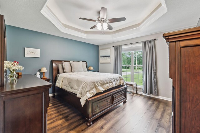 200 Lindsey Hollow Rd, Gallatin, TN 37066 - bedroom with a raised ceiling, dark wood finished floors, a ceiling fan, and baseboards
