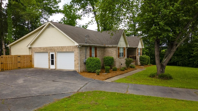 1054 Cragfront Est Loop, Gallatin, TN 37066 - ranch-style house with a garage, asphalt driveway, brick siding, and a shingled roof