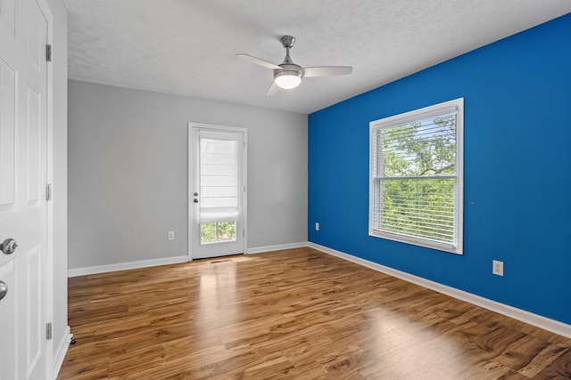 1054 Cragfront Est Loop, Gallatin, TN 37066 - empty room with ceiling fan, wood finished floors, a textured ceiling, and baseboards