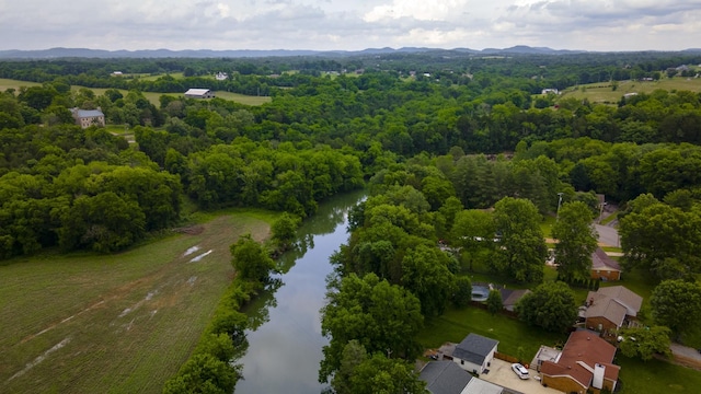 1054 Cragfront Est Loop, Gallatin, TN 37066 - aerial overview of property's location featuring a nearby body of water and a heavily wooded area