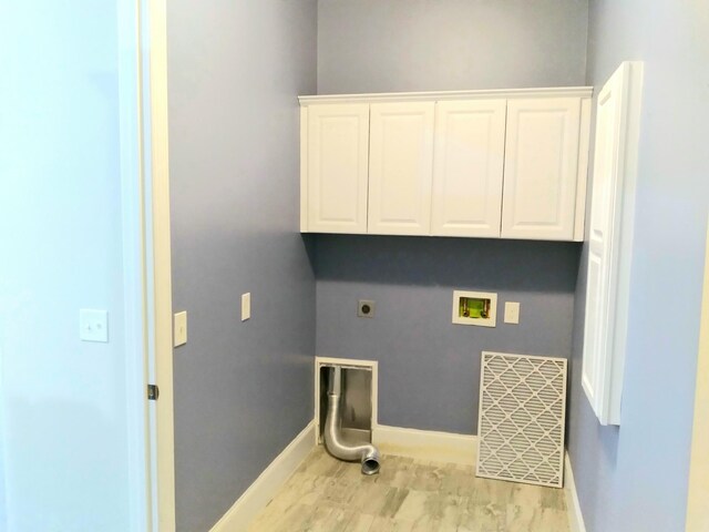 168 Cobbler Cir, Hendersonville, TN 37075 - washroom featuring hookup for a washing machine, hookup for an electric dryer, baseboards, light wood-style floors, and cabinet space