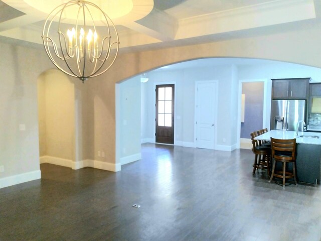 168 Cobbler Cir, Hendersonville, TN 37075 - dining space featuring arched walkways, a chandelier, baseboards, and dark wood-type flooring