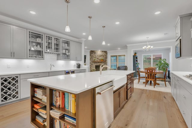 1815 Humphreys Gln, Spring Hill, TN 37174 - kitchen with stainless steel appliances, a sink, a chandelier, a center island with sink, and light countertops