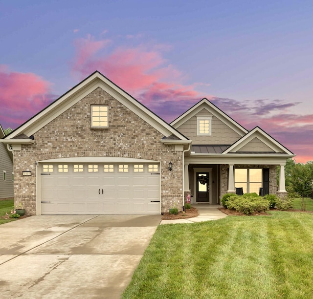 1815 Humphreys Gln, Spring Hill, TN 37174 - view of front of house featuring brick siding, concrete driveway, a yard, and a garage