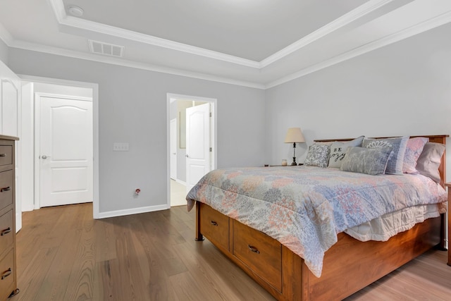 1815 Humphreys Gln, Spring Hill, TN 37174 - bedroom featuring a raised ceiling, wood finished floors, baseboards, and crown molding