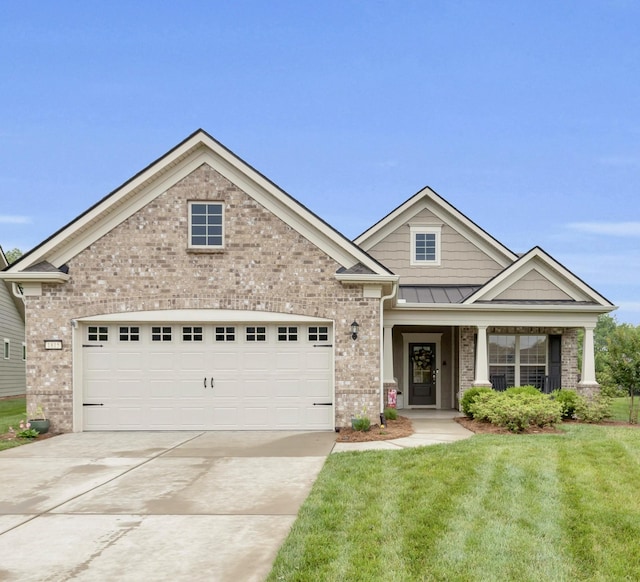 1815 Humphreys Gln, Spring Hill, TN 37174 - craftsman house featuring brick siding, driveway, a front lawn, and a garage