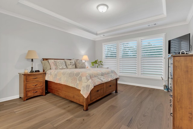 1815 Humphreys Gln, Spring Hill, TN 37174 - bedroom featuring a tray ceiling, wood finished floors, ornamental molding, and baseboards