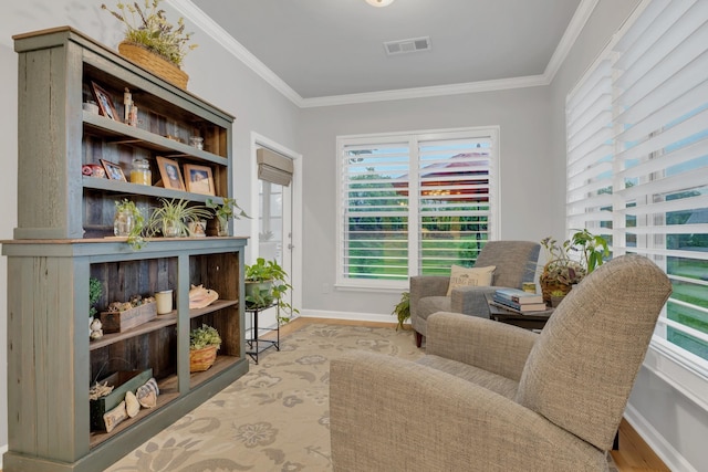1815 Humphreys Gln, Spring Hill, TN 37174 - living area featuring wood finished floors, ornamental molding, and baseboards