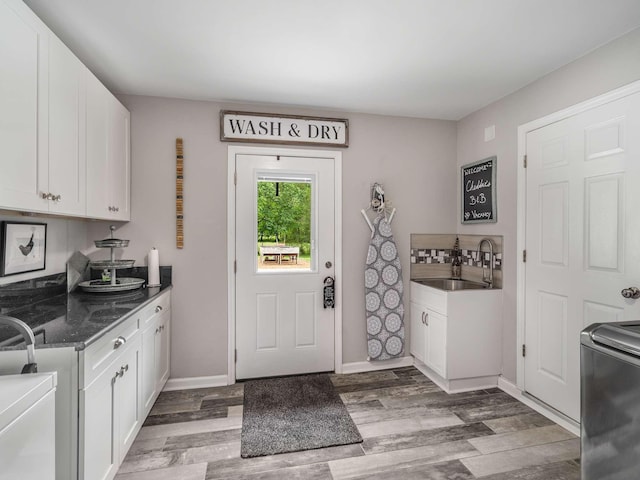 7119 Littlejohn Ln, Fairview, TN 37062 - laundry room featuring light wood-style floors and baseboards