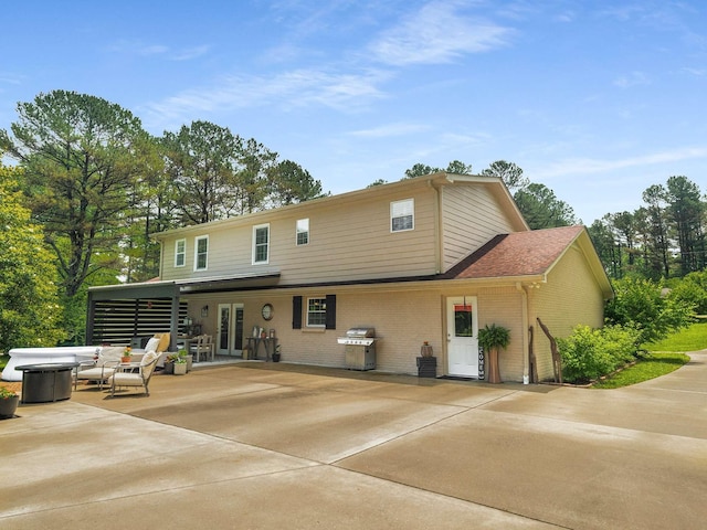 7119 Littlejohn Ln, Fairview, TN 37062 - rear view of property featuring a patio, brick siding, and french doors