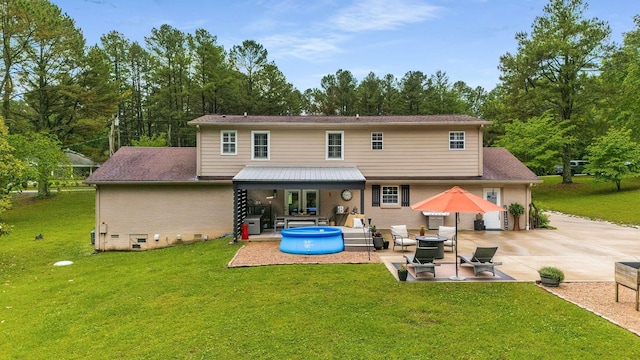 7119 Littlejohn Ln, Fairview, TN 37062 - rear view of property with a patio area and a lawn