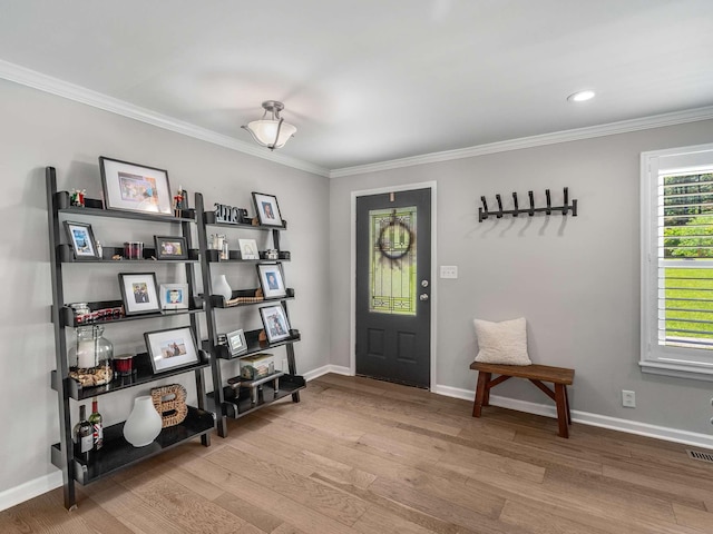 7119 Littlejohn Ln, Fairview, TN 37062 - foyer entrance with wood finished floors, ornamental molding, baseboards, and recessed lighting