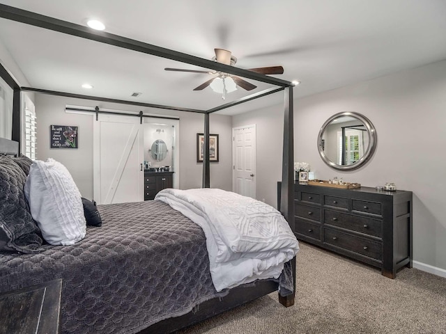 7119 Littlejohn Ln, Fairview, TN 37062 - bedroom featuring a barn door, carpet, recessed lighting, ceiling fan, and baseboards