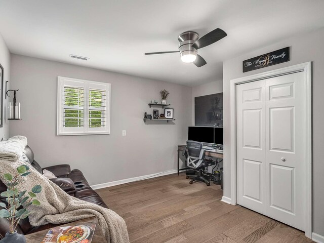 7119 Littlejohn Ln, Fairview, TN 37062 - living area with ceiling fan, a desk, light wood-style floors, and baseboards