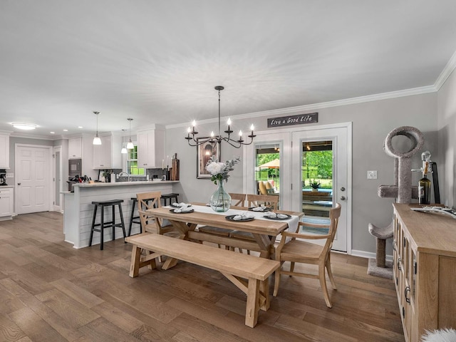 7119 Littlejohn Ln, Fairview, TN 37062 - dining room with crown molding, dark wood finished floors, a chandelier, and baseboards