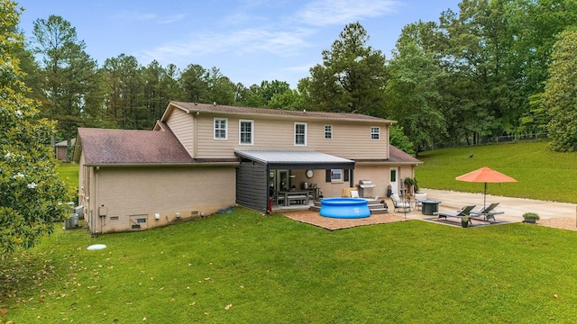 7119 Littlejohn Ln, Fairview, TN 37062 - rear view of house featuring a patio area, a hot tub, a lawn, central air condition unit, and crawl space