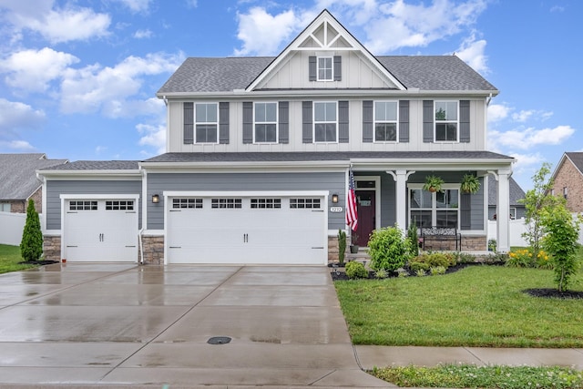 3232 Firerock Dr, Murfreesboro, TN 37128 - craftsman house featuring covered porch, board and batten siding, a front yard, driveway, and stone siding