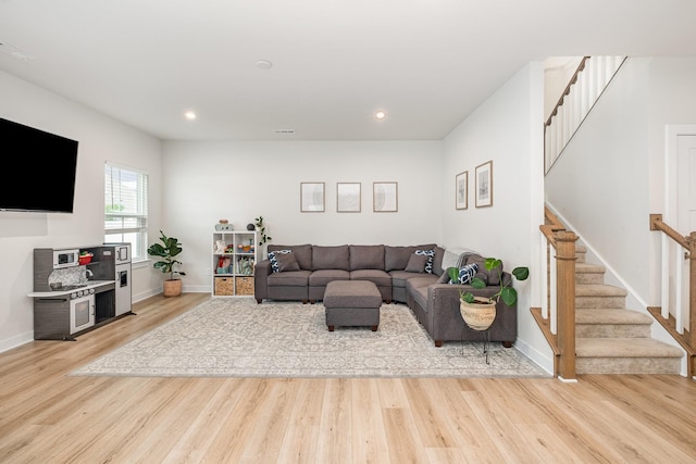 3232 Firerock Dr, Murfreesboro, TN 37128 - living area featuring stairs, light wood-style flooring, baseboards, and recessed lighting