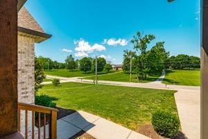 725B N Russell St, Portland, TN 37148 - view of green lawn with covered porch