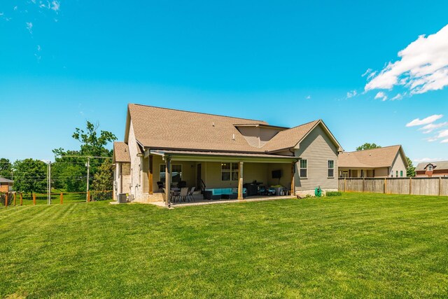 725B N Russell St, Portland, TN 37148 - rear view of house with outdoor lounge area, a patio, and roof with shingles