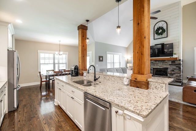 725B N Russell St, Portland, TN 37148 - kitchen featuring appliances with stainless steel finishes, open floor plan, a sink, dark wood-type flooring, and lofted ceiling