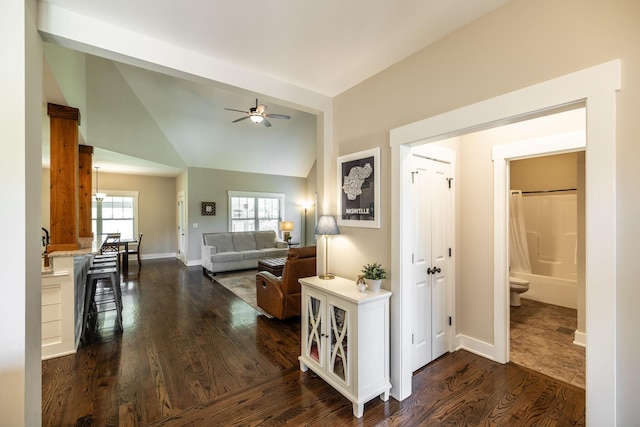 725B N Russell St, Portland, TN 37148 - hall with dark wood-style flooring, vaulted ceiling, and baseboards